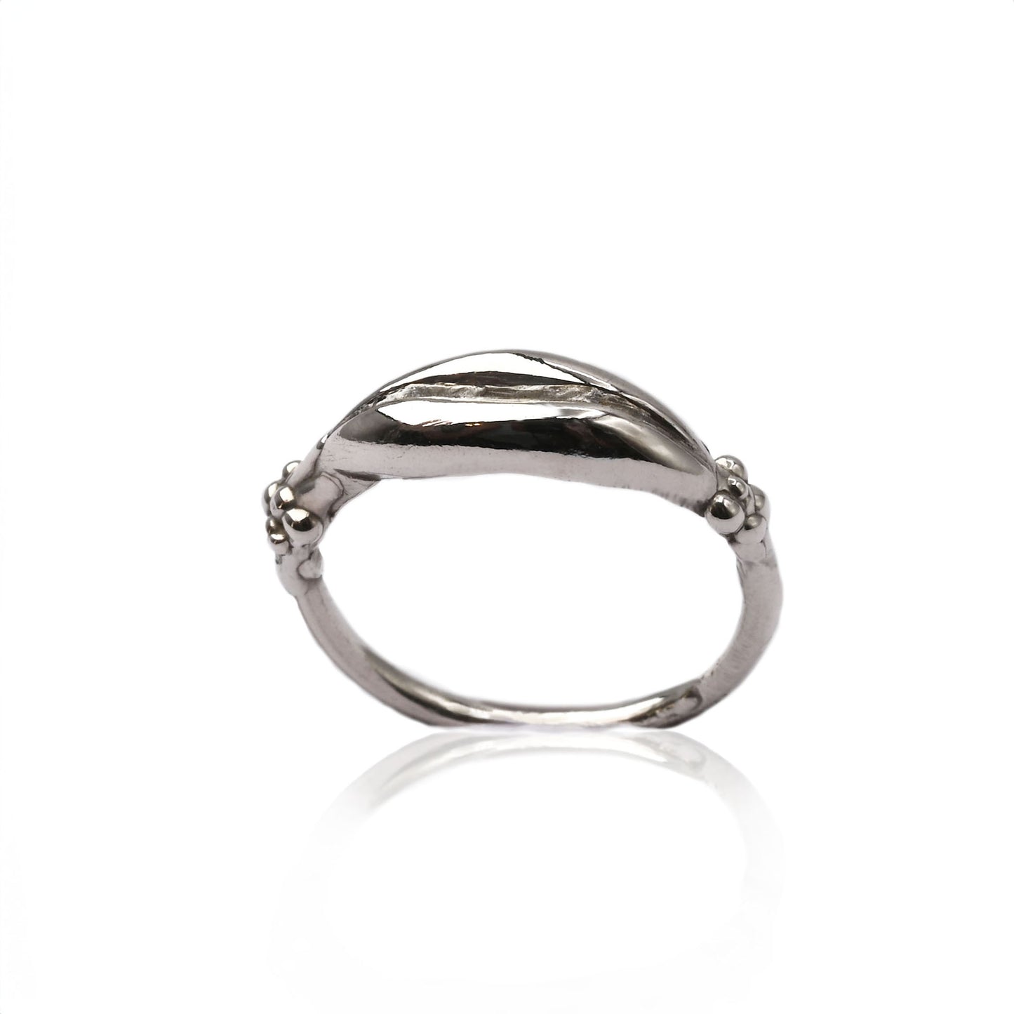Eve Impurity Ring in sterling silver featuring a minimalist vulva design with smooth, rounded lines and small bubble accents on each side, crafted using lost wax casting.