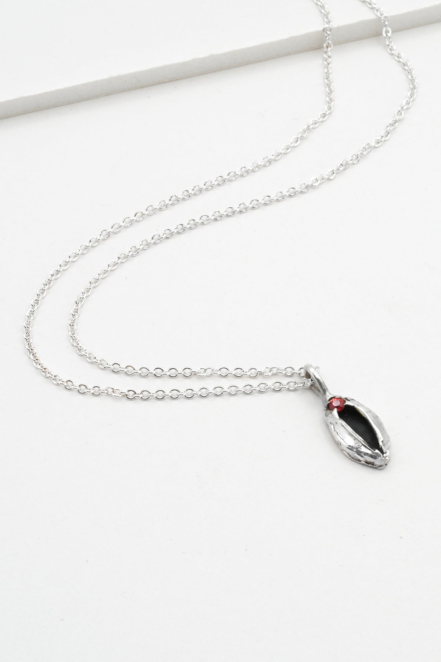 "Artemis" Necklace: Small Silver Vulva Pendant with Red Sapphire
