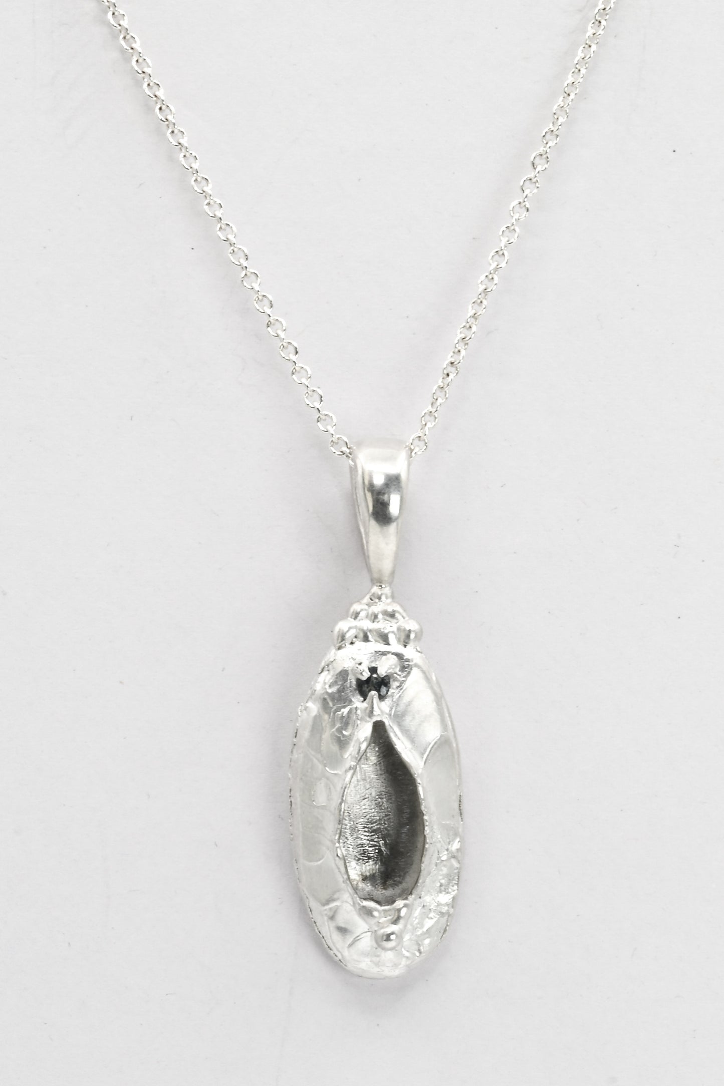 "Marina" Necklace: Large Silver Vulva Pendant with Dark Blue Sapphire