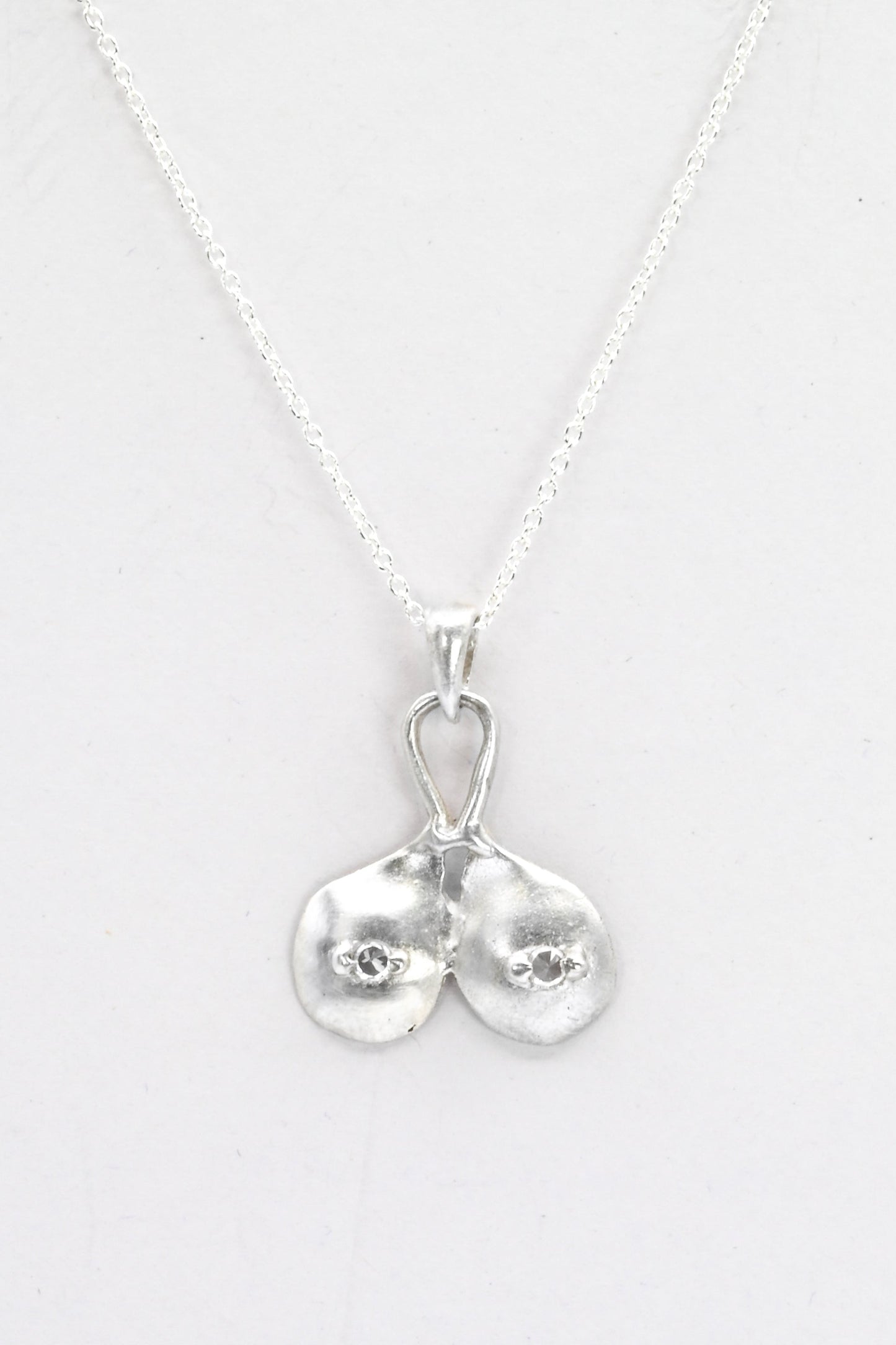 "Godiva" silver breasts pendant with white sapphire nipples, by Impurity Culture Jewelry