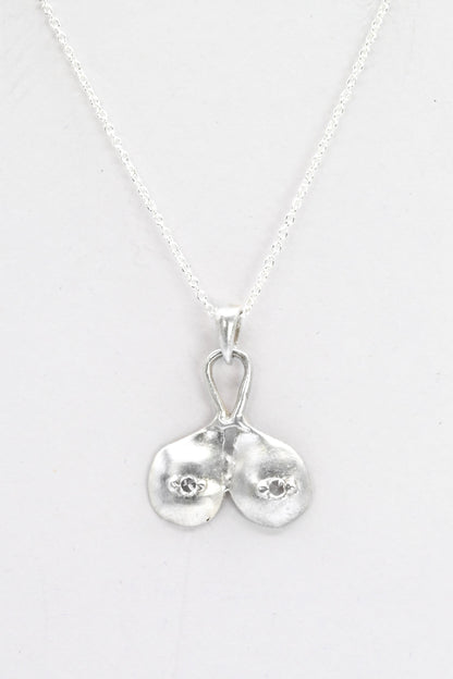 "Godiva" silver breasts pendant with white sapphire nipples, by Impurity Culture Jewelry