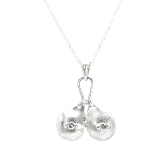 Silver boobs pendant with white sapphire nipples by Impurity Culture Jewelry 