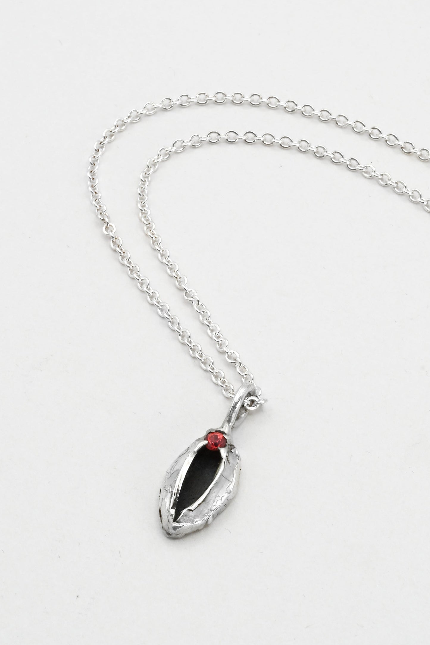 "Artemis" Necklace: Small Silver Vulva Pendant with Red Sapphire