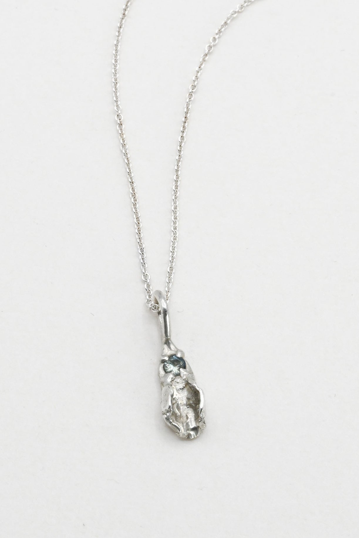 "Freyja" Necklace: Small Silver Vulva Pendant with Light Blue Sapphire