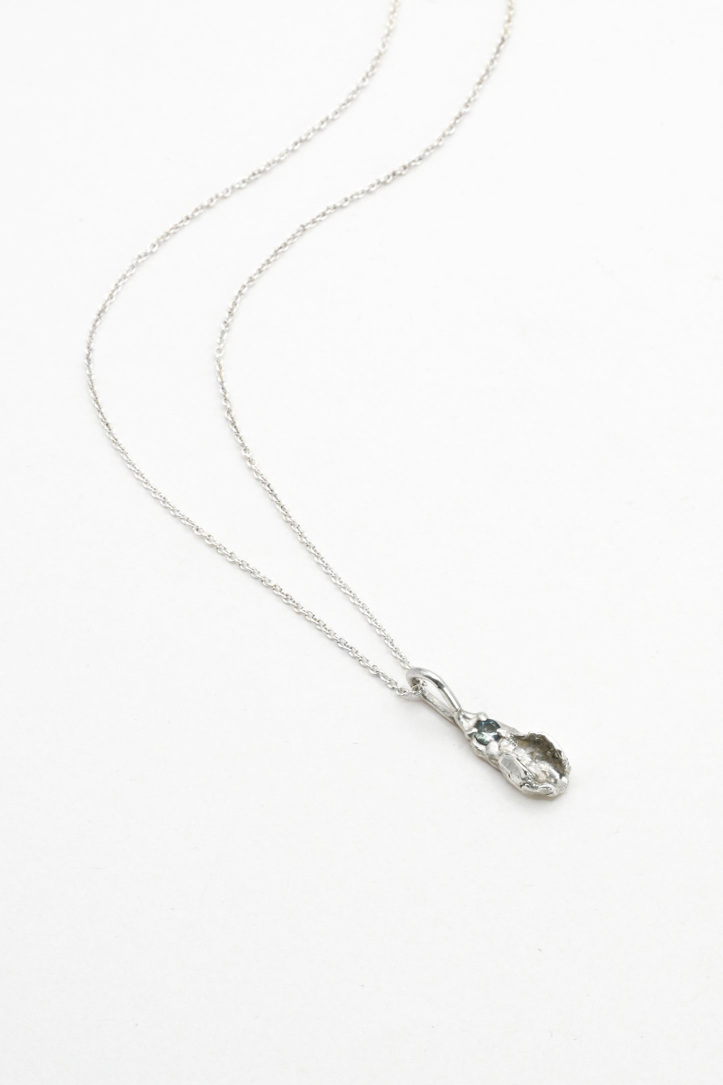 "Freyja" Necklace: Small Silver Vulva Pendant with Light Blue Sapphire