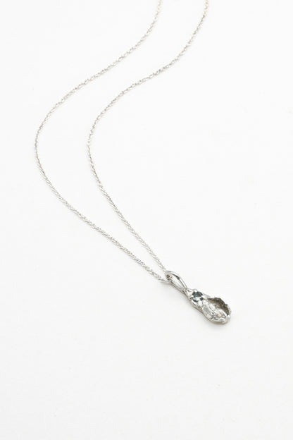 "Freyja" Necklace: Small Silver Vulva Pendant with Light Blue Sapphire