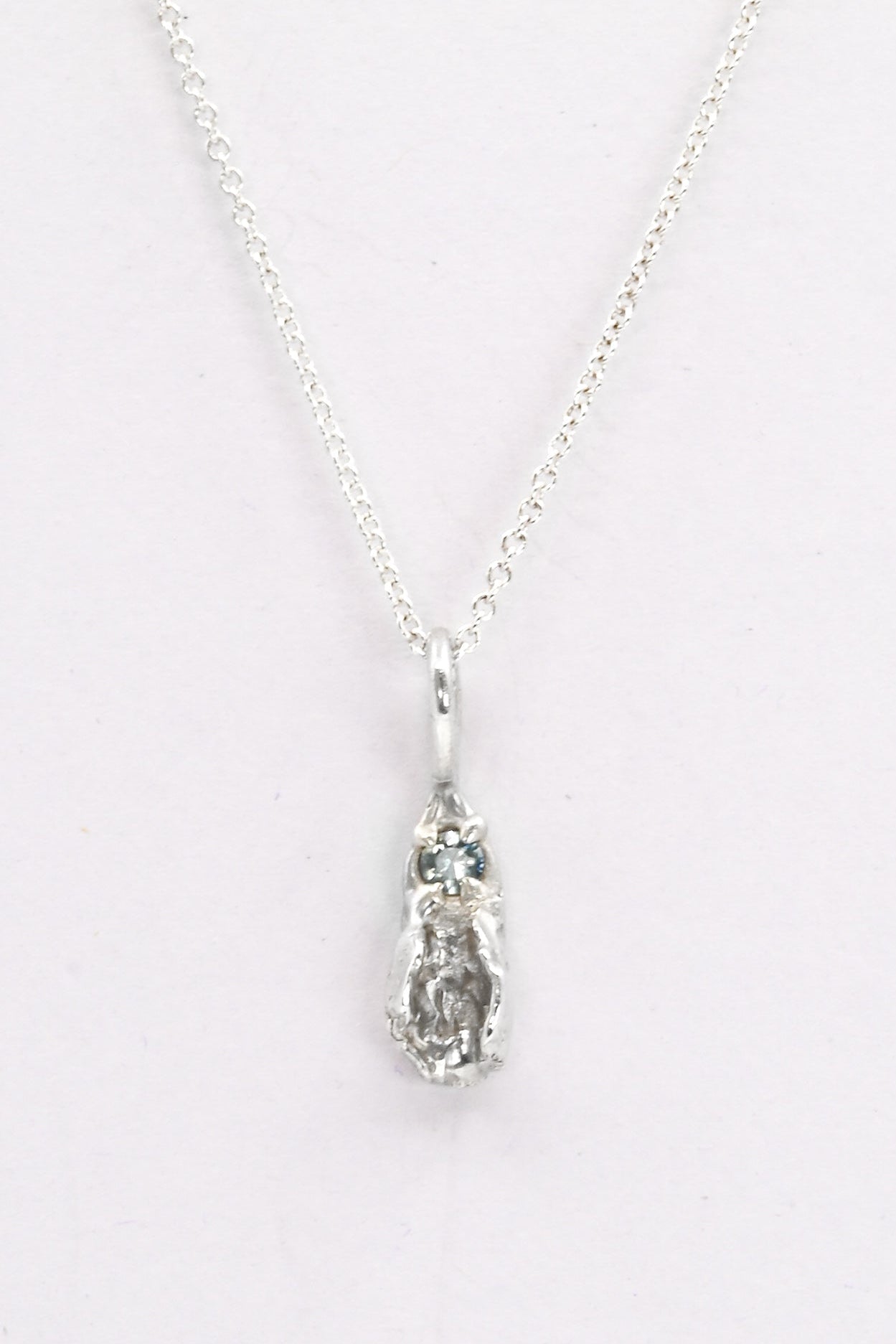 "Freyja" Necklace: Small Silver Vulva Pendant with Light Blue Sapphire